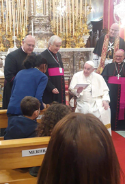 Pope Francis on a visit to Malta blesses women and children sheltered in Merhba Bik